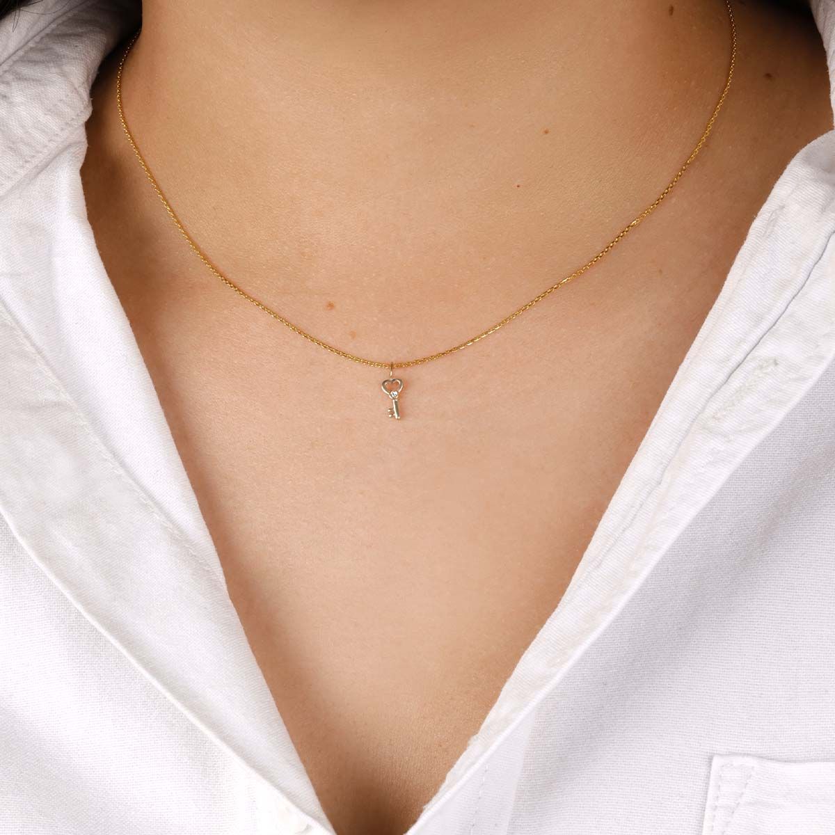 Collier Or Jaune 375/1000  "Clef du Cadenas Coeur"  Zirconium