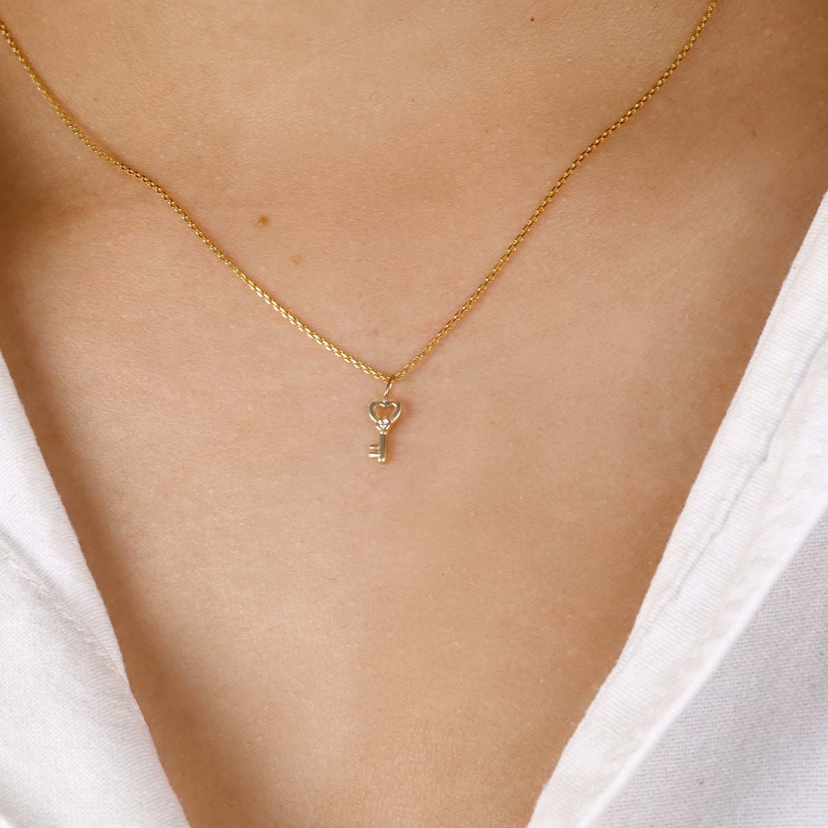 Collier Or Jaune 375/1000  "Clef du Cadenas Coeur"  Zirconium