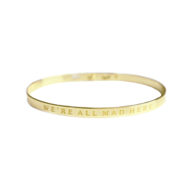 Bracelet Jonc à message laiton doré "WE'RE ALL MAD HERE" Bracelet Jonc à message laiton doré "WE'RE ALL MAD HERE"